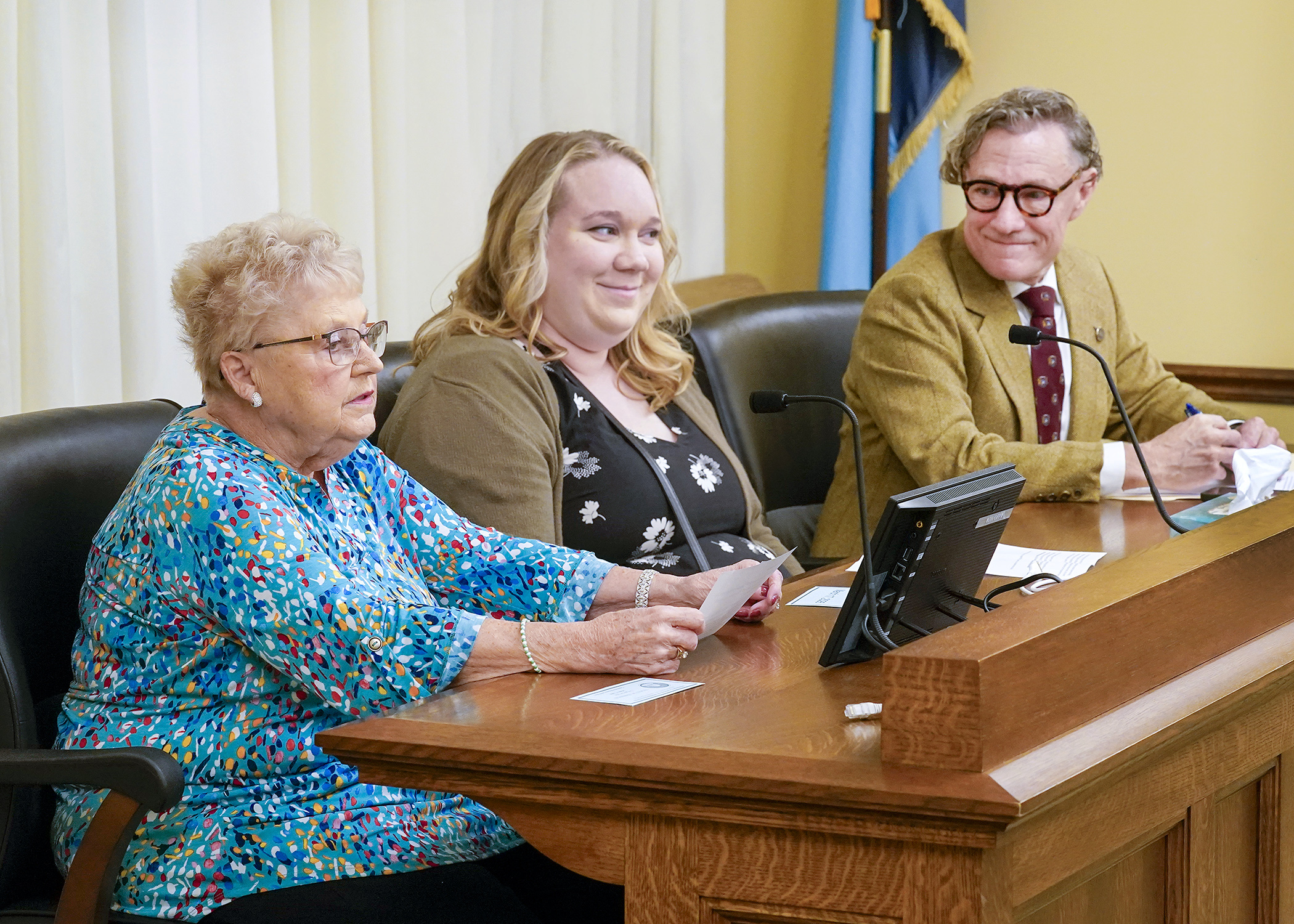 Anita LeBrun, a resident at Amira Choice in Champlin, urges the House commerce committee to approve a bill that would allow alcoholic beverage consumption in nursing homes. (Photo by Andrew VonBank)